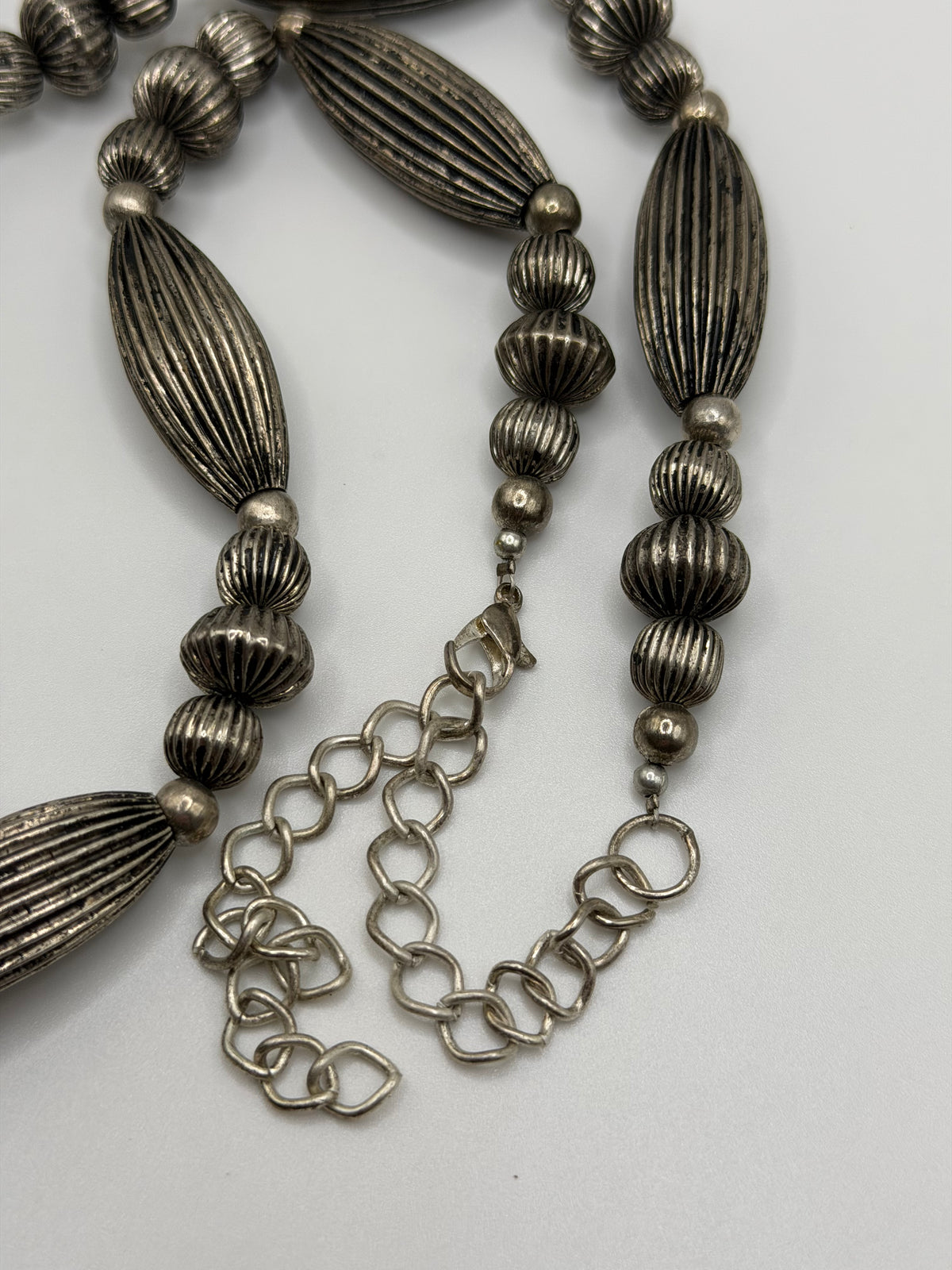 Southwestern style silver tone ribbed bead necklace
