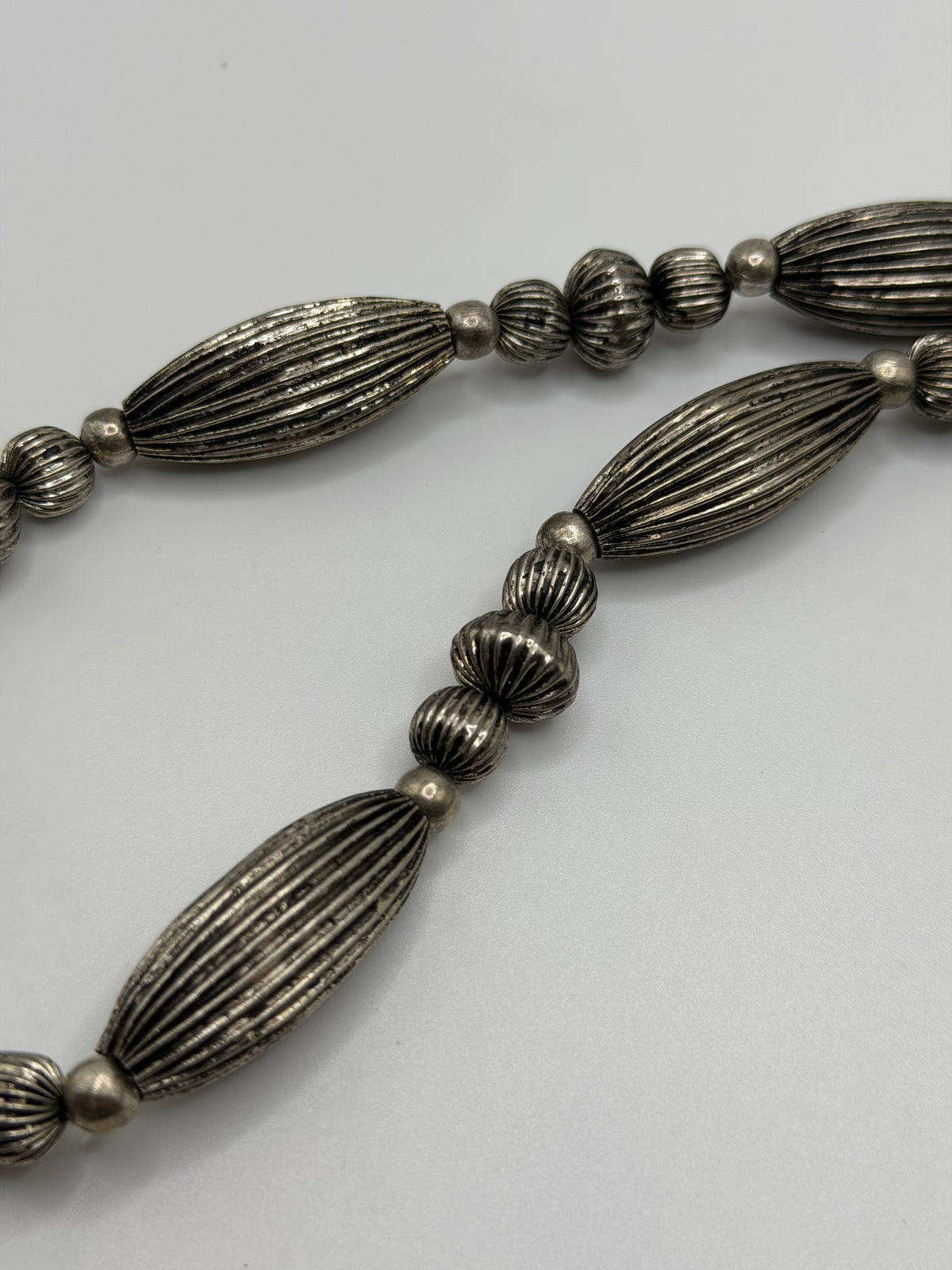 Southwestern style silver tone ribbed bead necklace